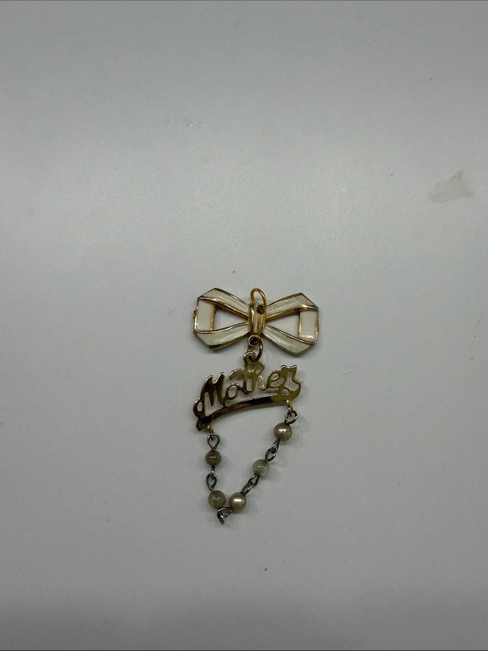 VINTAGE Gold Tone 'Males' Bow Pendant Necklace Charm in White and Gold